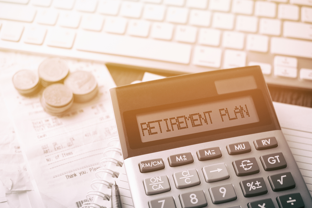 Calculator,with,text,retirement,plan.,calculator,,currency,,book,,bills,and