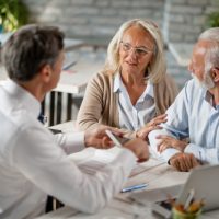 Senior,couple,communicating,with,insurance,agent,while,having,consultations,with